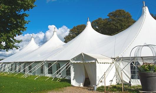 a line of sleek and modern portable restrooms ready for use at an upscale corporate event in Lake Grove, NY